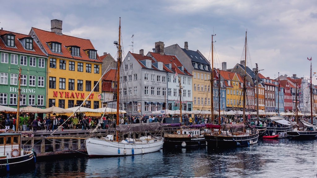 View of buildings and boats on the edge of the river running through Copenhagen, Denmark