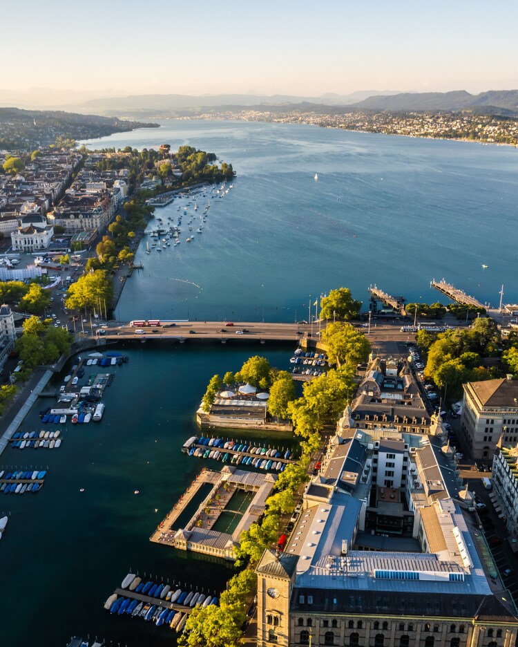 View of a European city on a large river as seen from a drone